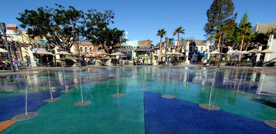 large public water fountain near the plaza on a sunny day