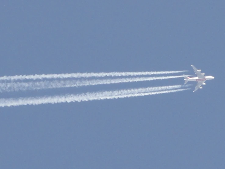 two jets make contrails in the sky