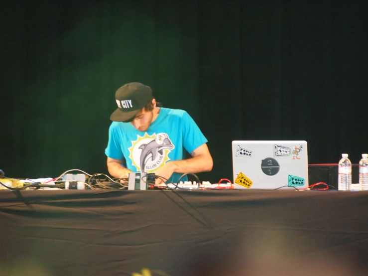 a man is at a desk with a laptop