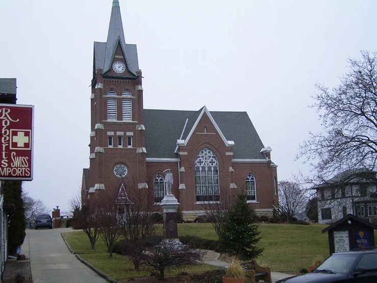 the church is next to some parked cars