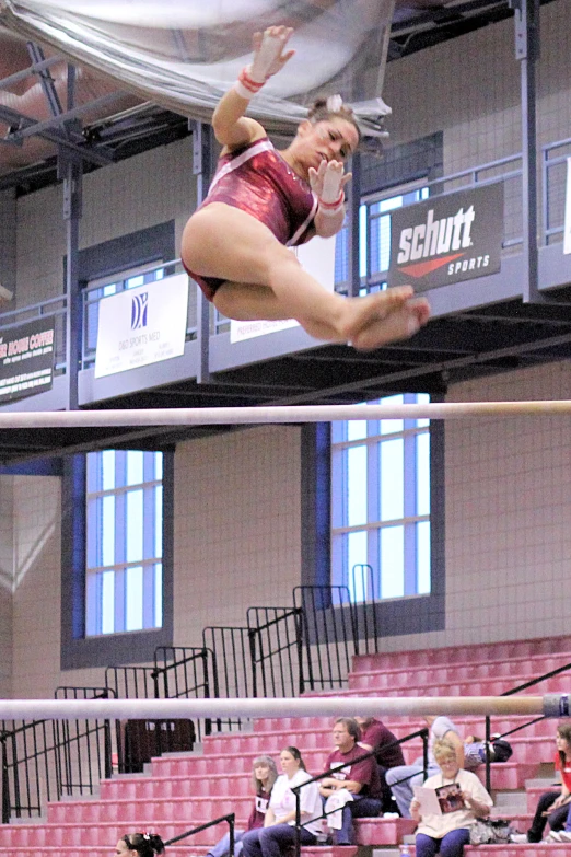 a woman on a high jump over the net