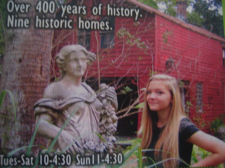 a picture of a woman next to a statue