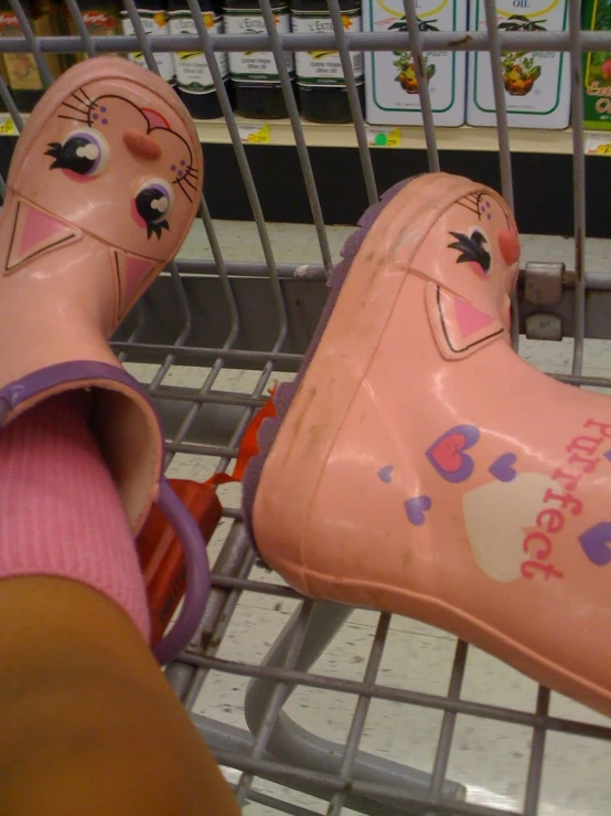 an item on display inside a store with pink shoes