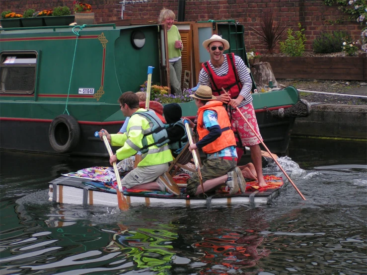 a group of people that are in a small boat