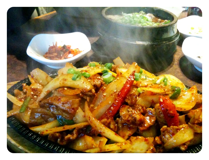 a plate topped with lots of meat and veggies