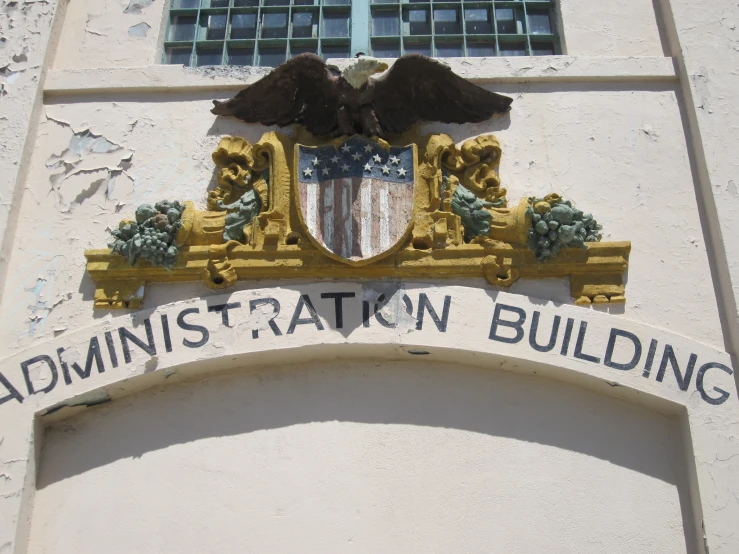an emblem above the entrance to a building