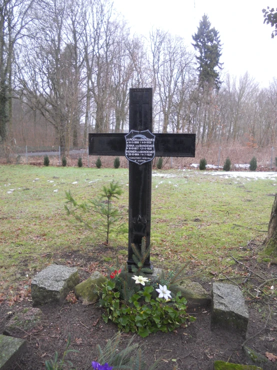 a black cross sits on some stone steps