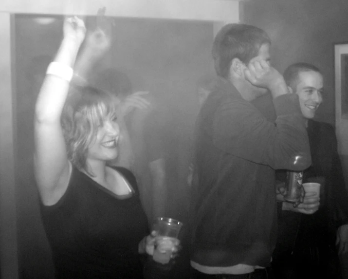 black and white po of two people enjoying a party