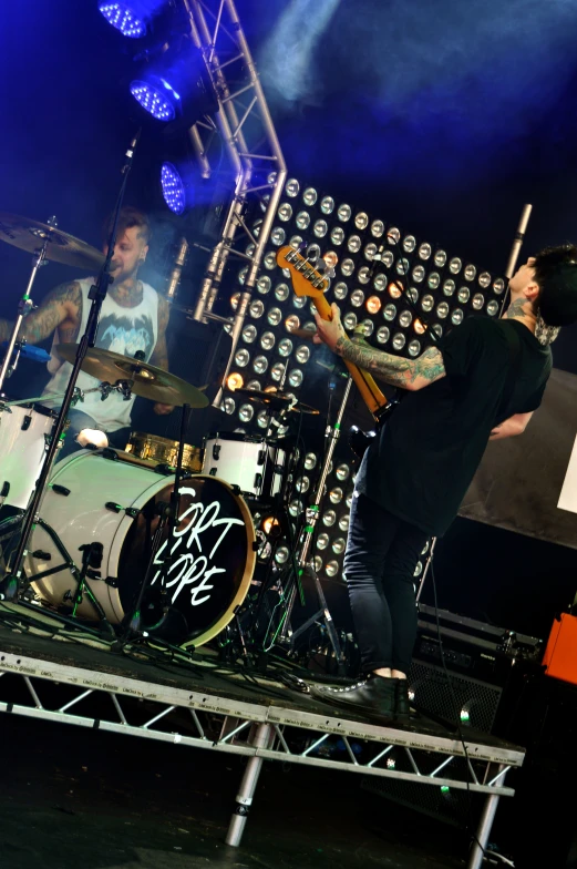 the band performs on the stage with its instruments