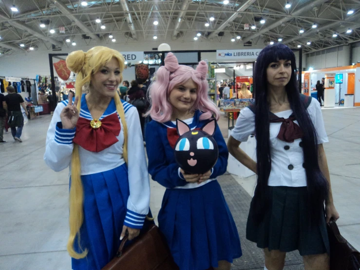 four girls are dressed up as anime characters
