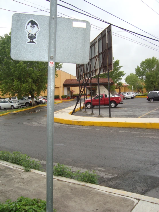 a street with many cars and parking spaces near it