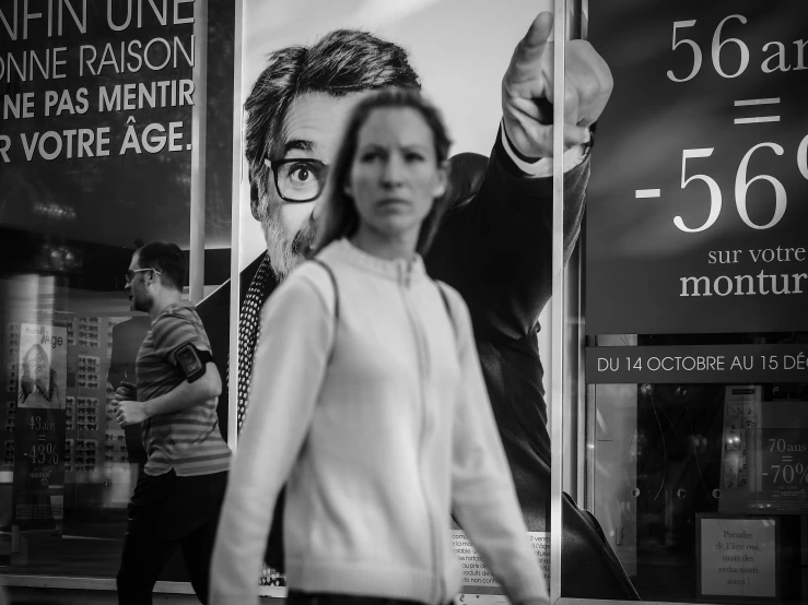 a person standing in front of a store window