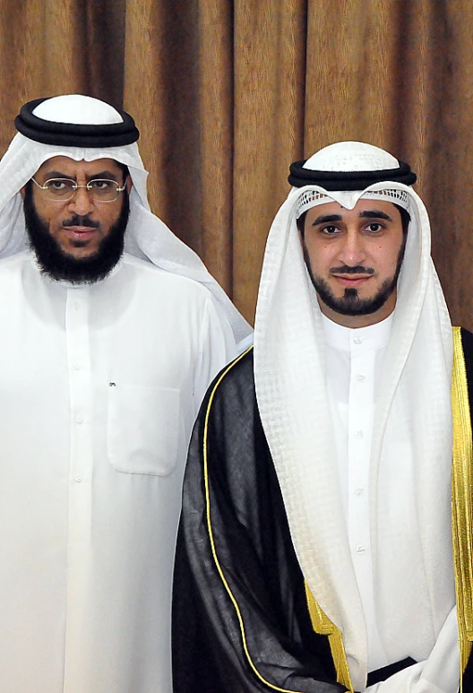 a couple of men in white and yellow outfits