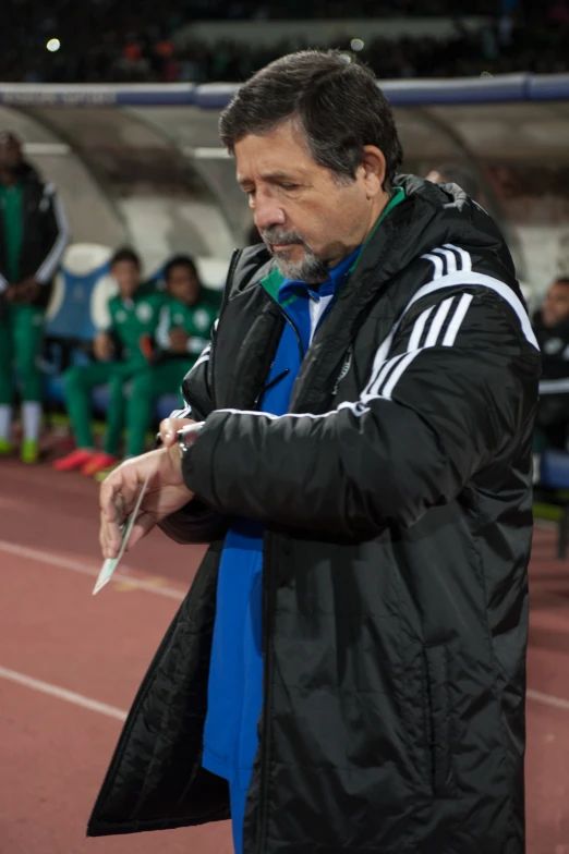 man holding a white object while on a track