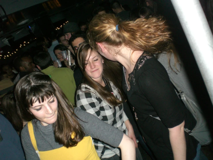 two young women sharing an adorable moment at the dance