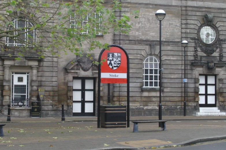 a street corner with a bench on the corner