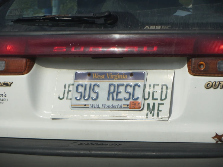 a white license plate with the words jesus rested me in the middle
