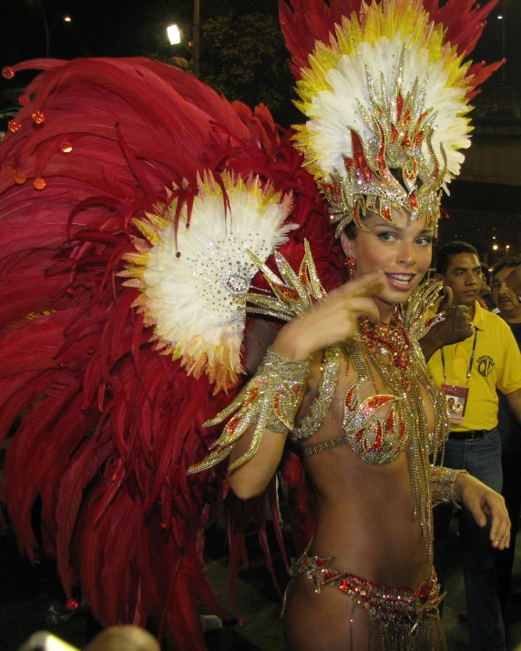 a young lady in a costume standing by others