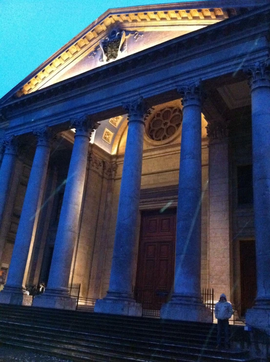 a very large building with columns and steps