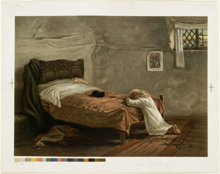 a woman lying on the floor by a bed with a cat laying on it