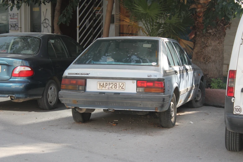 two cars are parked in front of each other