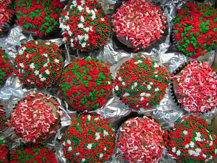 christmas candies and sprinkles are on display at a candy store