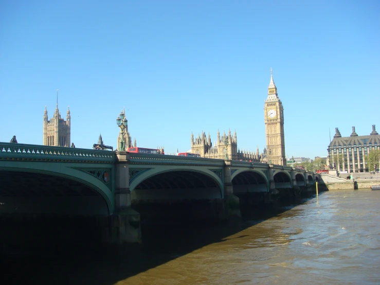 a bridge that has many traffic lights above it