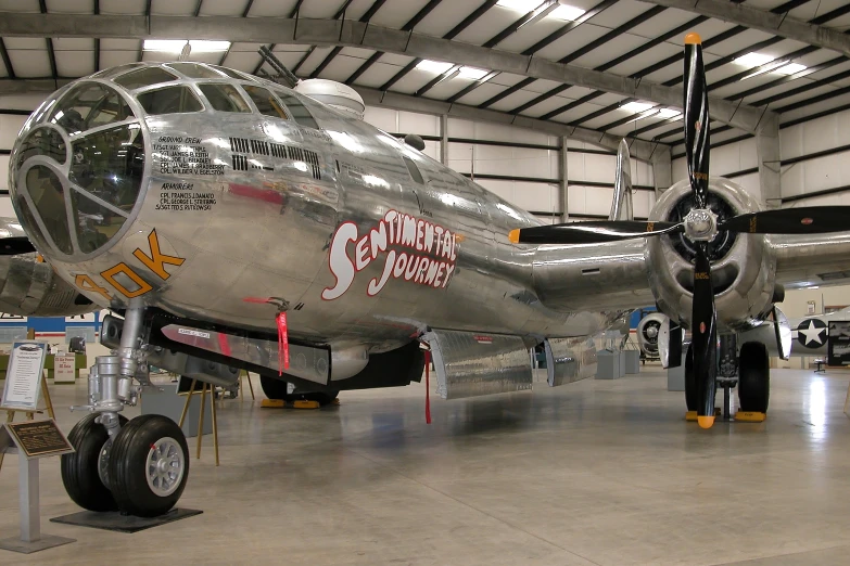 an airplane on display inside a hangar and in its markings