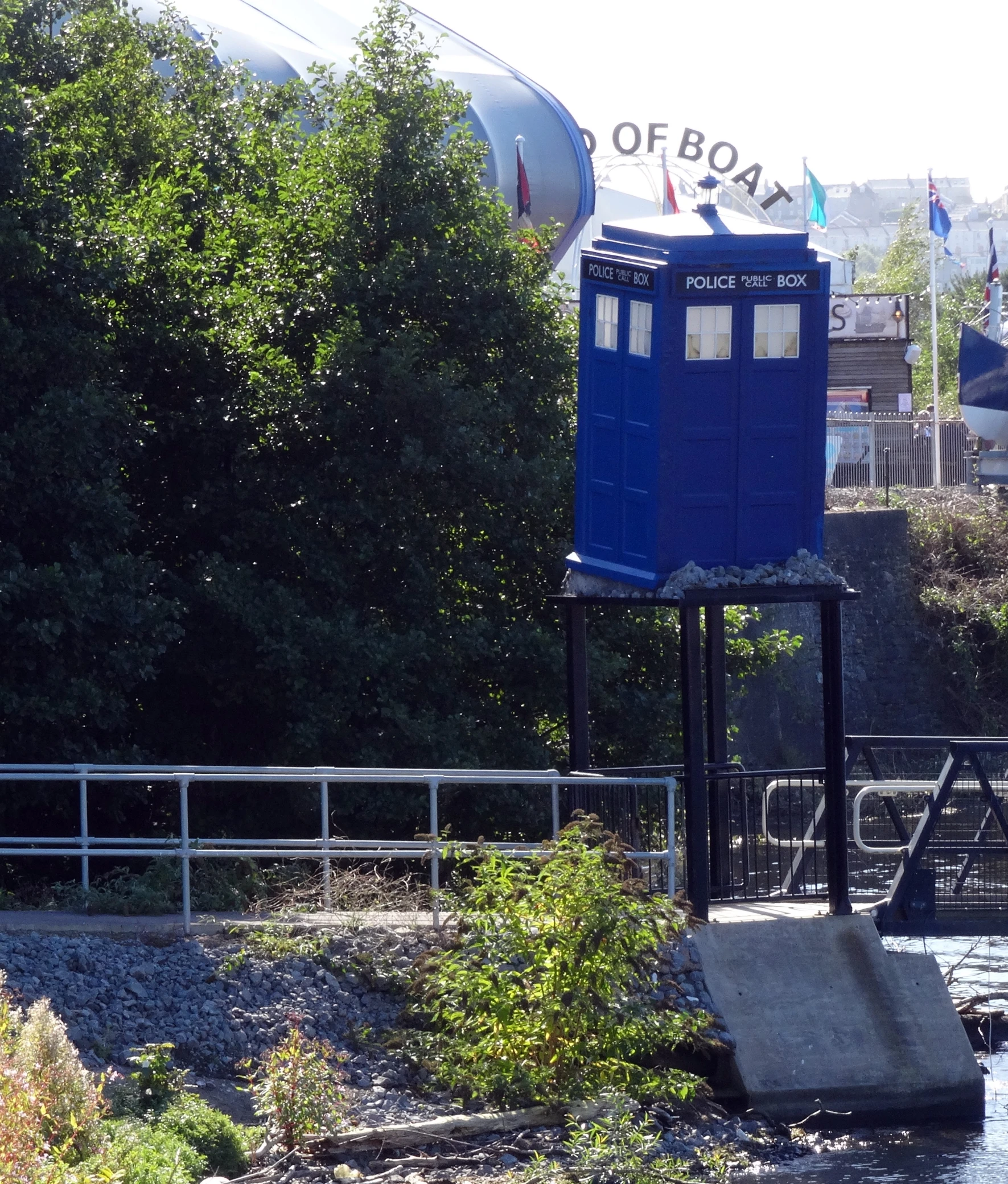 a blue box that is sitting on a dock