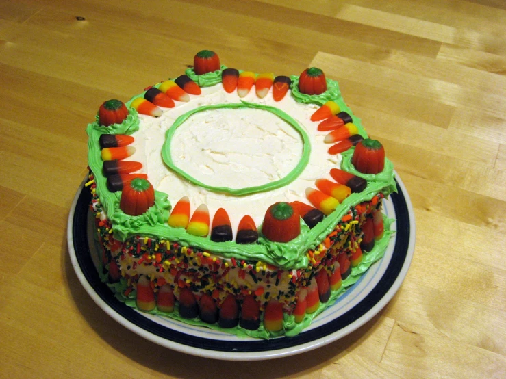 there is a cake decorated with candy and green frosting