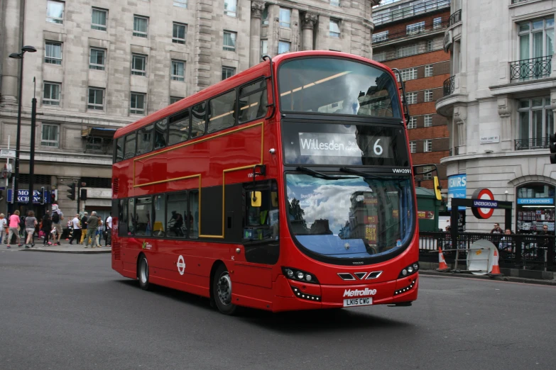 a double decker bus is on the street