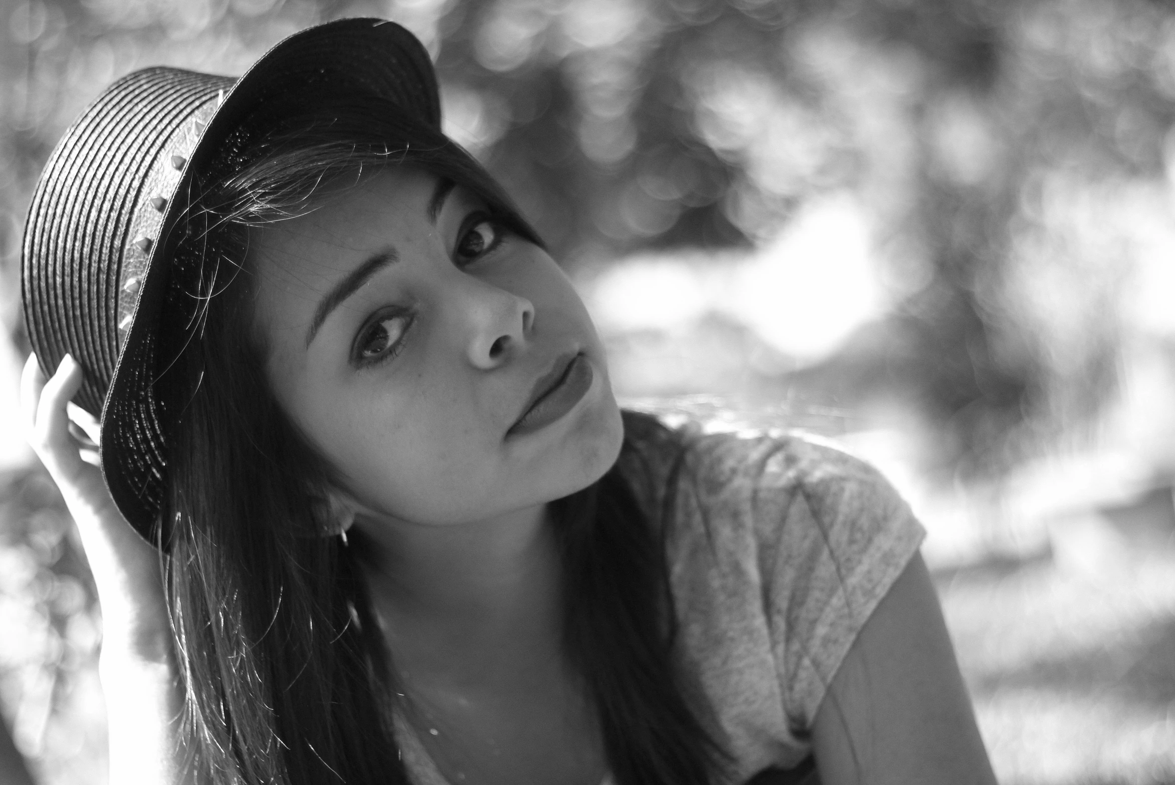 black and white pograph of a woman with a hat