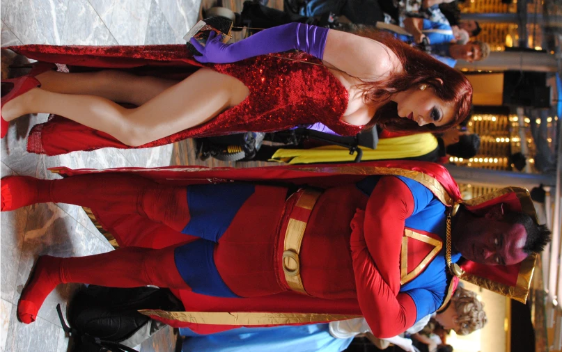 the man and woman dressed as comic characters