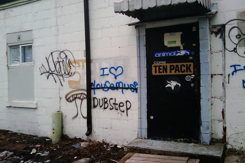 graffiti is sprayed all over the doors of a building