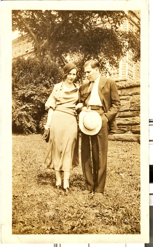 a vintage po of two people wearing old fashioned clothing