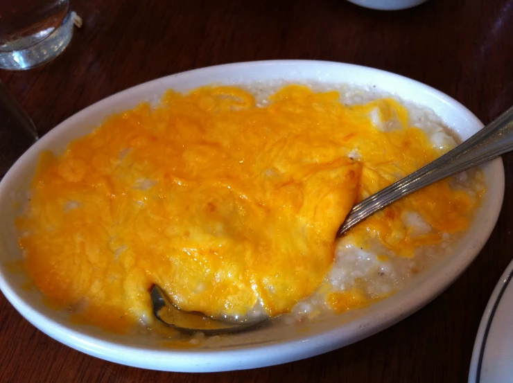 a bowl of food is shown with a spoon