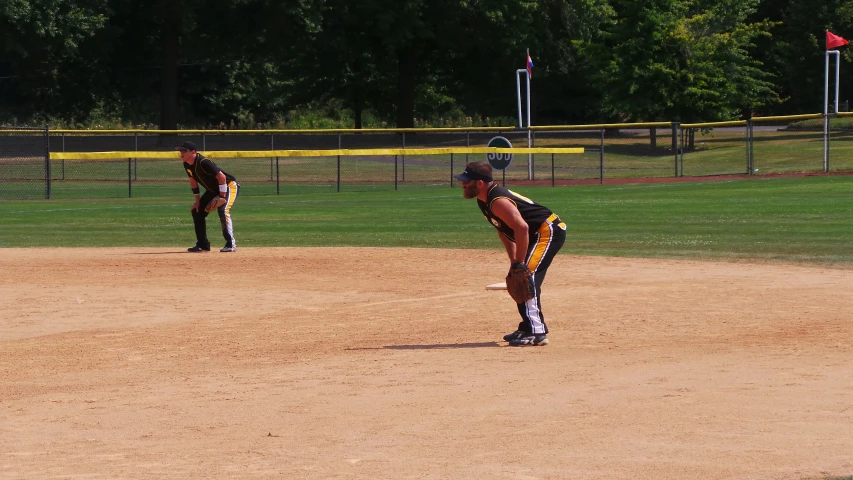 a boy is playing in a softball game