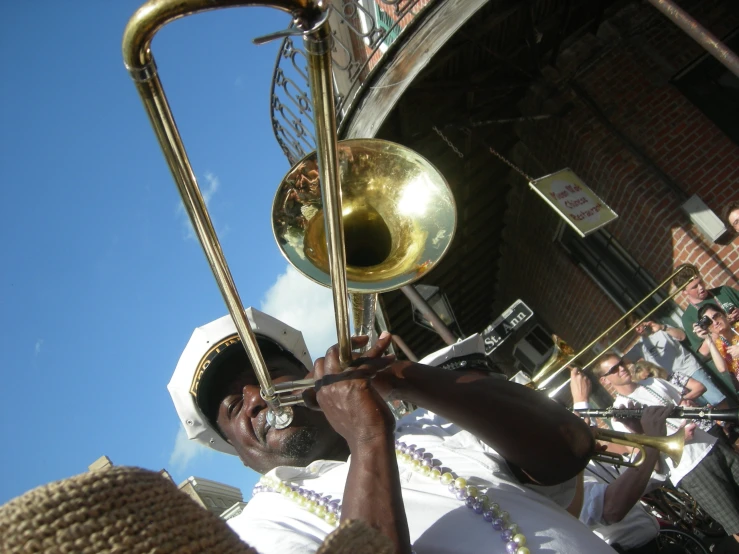 a man in white holding up a ss instrument