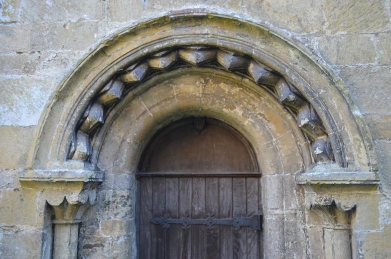 a large stone building with an arched doorway