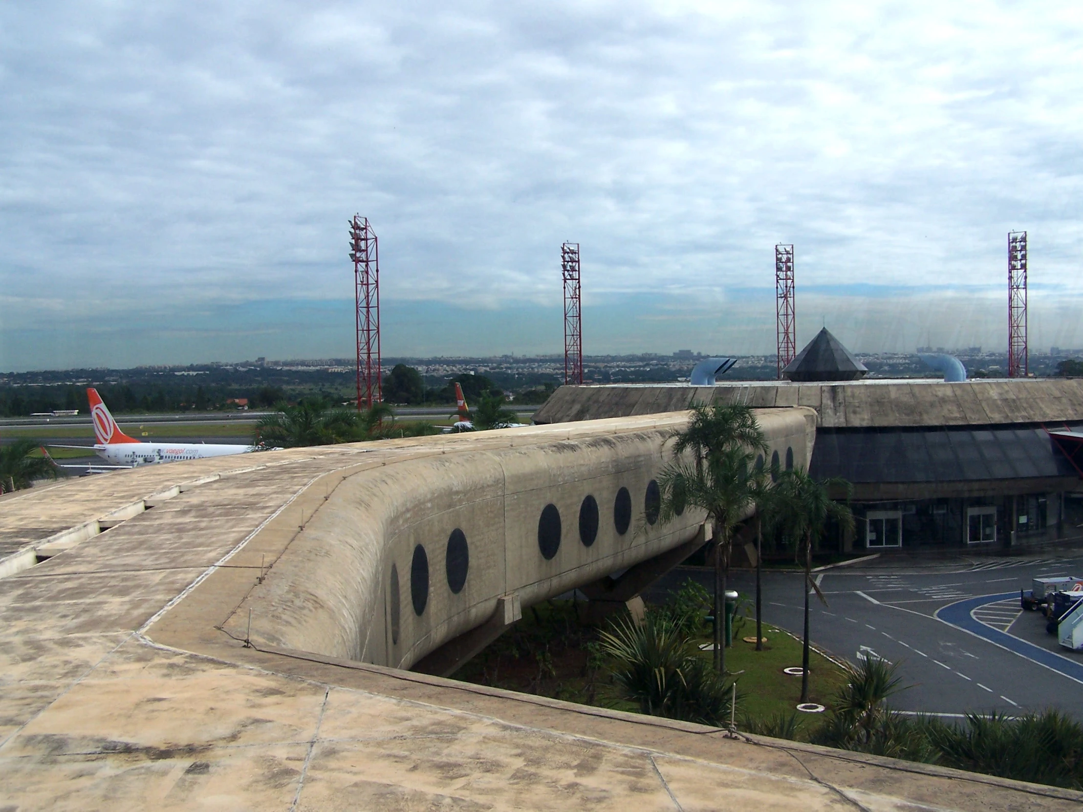 a large air port with an airplane landing strip