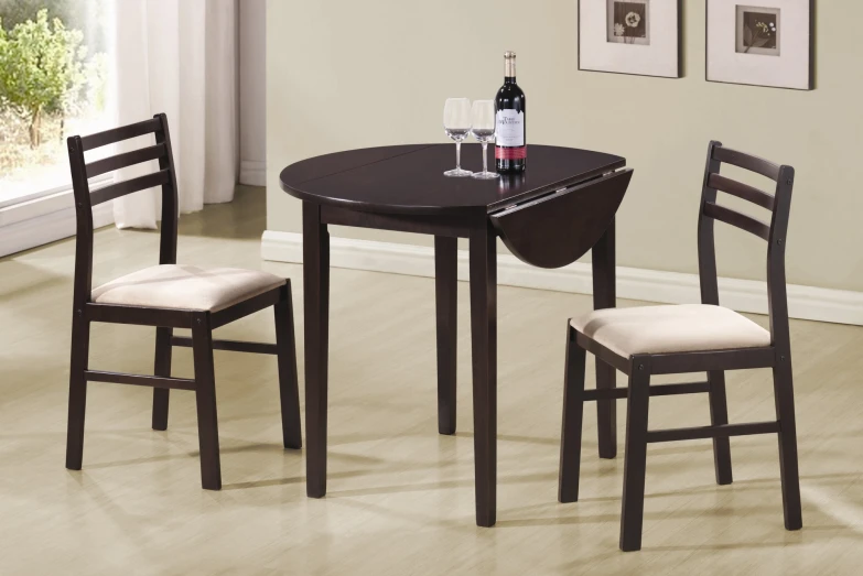 two small black wooden dining tables with cream colored chairs