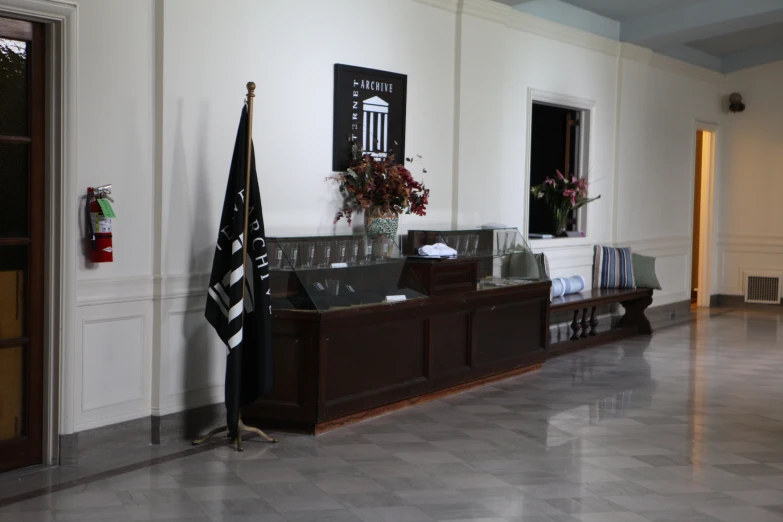 two large flags are hanging on the wall next to a counter