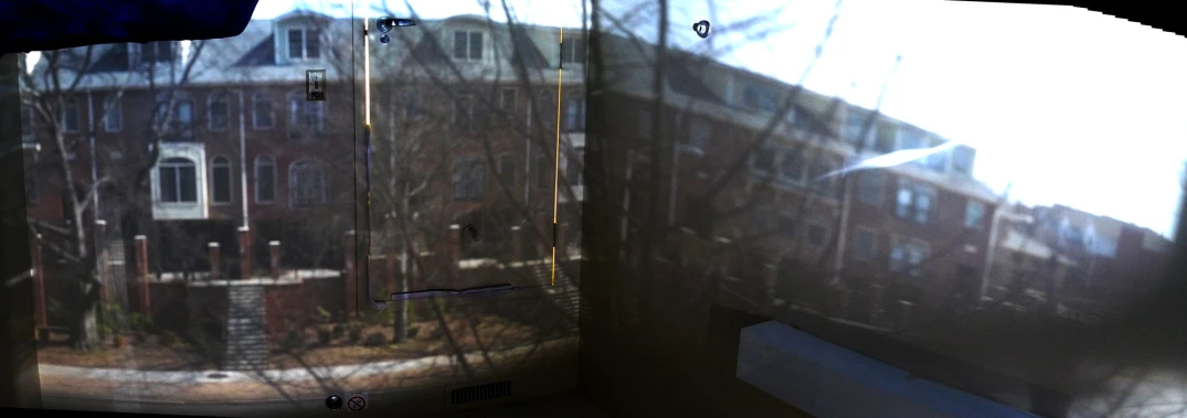 a building seen through frosted glass with an opening