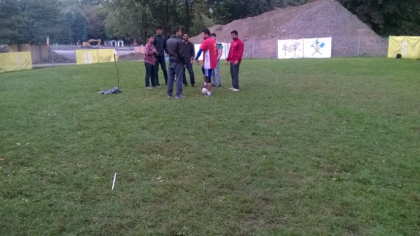 the young men are together and playing frisbee