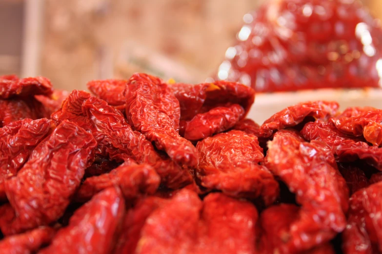 a pile of goji berries with one portion gone