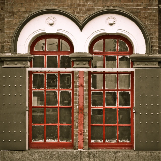 an orange and black fire escape with red windows