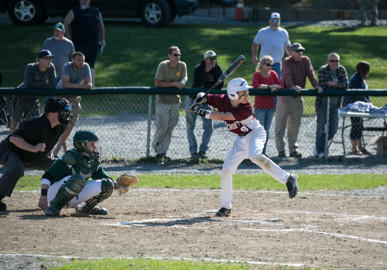 a baseball player standing next to home plate