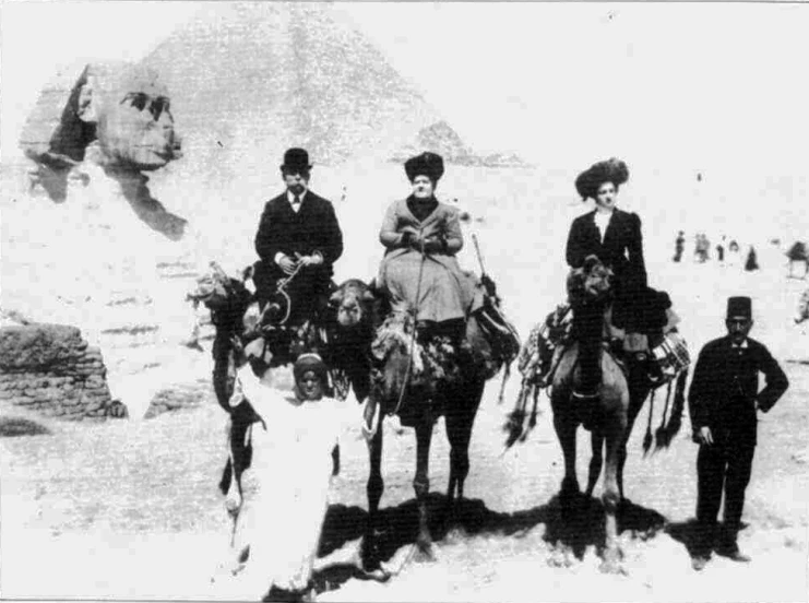 a group of men and women riding camels in the snow