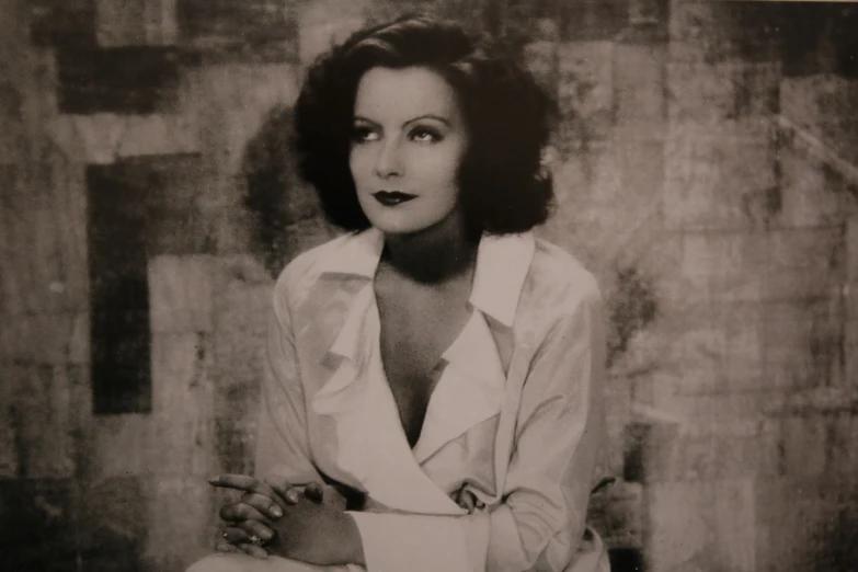 a black and white po of a woman wearing a shirt
