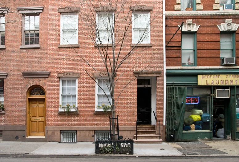 a tall brick building with a small window